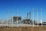 Wait for the thud Photo by Mississippi Power
TURBINE POWER: The combined cycle plant is in the foreground, with the heat recovery steam generator smoke stacks looming behind it.