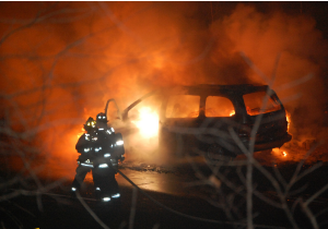 Firemen Fight an auto fire